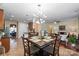 Open-concept home with dining area, leading into the kitchen, and living room at 10116 Garman Hill Dr, Charlotte, NC 28214