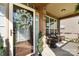 Inviting front porch with decorative wreath, wicker seating, and a stylish tiled floor for relaxing outdoor enjoyment at 10116 Garman Hill Dr, Charlotte, NC 28214