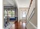 Inviting entryway with hardwood floors, stairway and beautiful moldings, providing a warm welcome into the home at 10116 Garman Hill Dr, Charlotte, NC 28214