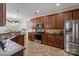 Spacious kitchen with stainless steel appliances, granite counters, and dark wood cabinetry at 10116 Garman Hill Dr, Charlotte, NC 28214