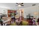 Open-concept living space featuring hardwood floors, ceiling fan, and a seamless transition to the adjacent kitchen at 10116 Garman Hill Dr, Charlotte, NC 28214