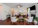 Bright living room with hardwood floors, ceiling fan, fireplace, and stylish furniture creating a cozy atmosphere at 10116 Garman Hill Dr, Charlotte, NC 28214