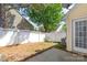 View of the backyard with white fence and patio, perfect for outdoor entertaining at 11011 Alderbrook Ln, Charlotte, NC 28270