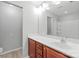 Bathroom featuring cherry cabinets, vanity with sink, large mirror and recessed lighting at 11011 Alderbrook Ln, Charlotte, NC 28270