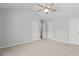 Bright bedroom with plush carpet, neutral walls, and a ceiling fan for added comfort at 11011 Alderbrook Ln, Charlotte, NC 28270