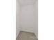 Walk-in closet with neutral carpet and walls, offering ample storage space at 11011 Alderbrook Ln, Charlotte, NC 28270