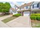 Charming two-story home with attached garage and well-maintained landscaping at 11011 Alderbrook Ln, Charlotte, NC 28270
