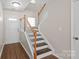 Foyer showcasing hardwood floors, staircase, and ample natural light from the front door at 11011 Alderbrook Ln, Charlotte, NC 28270