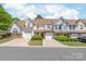 Charming townhomes with attached garages, manicured lawns, and inviting curb appeal at 11011 Alderbrook Ln, Charlotte, NC 28270