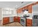 Functional kitchen featuring stainless steel appliances, and wood cabinetry at 11011 Alderbrook Ln, Charlotte, NC 28270