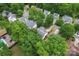 Aerial view showcases a neighborhood with mature trees, manicured lawns and well-maintained homes at 11913 Little Stoney Ct, Charlotte, NC 28269