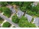 Aerial view of a well-maintained home nestled among lush green trees in a quiet neighborhood at 11913 Little Stoney Ct, Charlotte, NC 28269