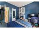 Cozy bedroom with built-in shelving and desk, perfect for a study or workspace at 11913 Little Stoney Ct, Charlotte, NC 28269