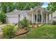 Charming single-Gathering home with a manicured front lawn, beautiful landscaping and covered porch at 11913 Little Stoney Ct, Charlotte, NC 28269