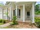 Inviting front porch with white columns and railings, perfect for enjoying the outdoors at 11913 Little Stoney Ct, Charlotte, NC 28269