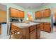 Functional kitchen featuring wooden cabinets, a center island and modern appliances at 11913 Little Stoney Ct, Charlotte, NC 28269
