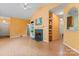 Bright living room showcasing fireplace, vaulted ceilings, and built-in shelving and cabinets for stylish storage at 11913 Little Stoney Ct, Charlotte, NC 28269
