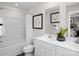 Clean bathroom with white vanity, dual sinks, framed mirror, and tub-shower combination at 120 Elm Forest Ln, China Grove, NC 28023