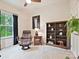 Relaxing bedroom featuring a leather recliner, bookshelf, and natural light creates a cozy and inviting space at 12641 Glowing Peak Rd, Huntersville, NC 28078