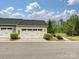 Attached two-car garage provides convenient parking, set within a beautifully landscaped front yard at 12641 Glowing Peak Rd, Huntersville, NC 28078