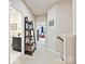 Hallway with a view to the bathroom and the bedroom, complete with a decorative bookshelf at 12641 Glowing Peak Rd, Huntersville, NC 28078