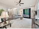 Bright living room with dark wood floors, a large window and a comfortable seating area at 12641 Glowing Peak Rd, Huntersville, NC 28078