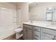 Bright bathroom featuring a tub and shower combination and a double vanity with modern fixtures at 13210 Kenworth Rd, Charlotte, NC 28278
