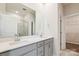 Elegant bathroom with double vanity, large mirror, and gray cabinets at 13210 Kenworth Rd, Charlotte, NC 28278