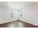 Bright bedroom with ample natural light, wood floors, and neutral walls, perfect for a serene living space at 13210 Kenworth Rd, Charlotte, NC 28278