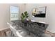 Dining area featuring a black marble table and white chairs at 13210 Kenworth Rd, Charlotte, NC 28278