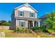 Charming two-story home with gray siding, black shutters, and a well-manicured front yard at 13210 Kenworth Rd, Charlotte, NC 28278