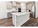 Spacious kitchen with stainless steel appliances, large island, and gray cabinets at 13210 Kenworth Rd, Charlotte, NC 28278