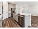 Modern kitchen featuring stainless steel appliances, quartz countertops, and a large island at 13210 Kenworth Rd, Charlotte, NC 28278