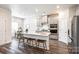 Contemporary kitchen with stainless steel appliances, a quartz countertop island, and bar stool seating at 13210 Kenworth Rd, Charlotte, NC 28278