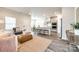 Open-concept living area adjacent to kitchen with modern decor and hardwood floors at 13210 Kenworth Rd, Charlotte, NC 28278