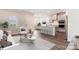 Bright open-concept living room flows into the kitchen with an island and stainless steel appliances at 13210 Kenworth Rd, Charlotte, NC 28278