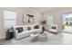 Bright living room with a white sofa and a round coffee table at 13210 Kenworth Rd, Charlotte, NC 28278