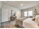 Bright main bedroom features a dresser and comfortable furnishings at 13210 Kenworth Rd, Charlotte, NC 28278