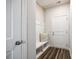 Bright mudroom boasts wood-look flooring, convenient bench seating, and storage cubbies at 13210 Kenworth Rd, Charlotte, NC 28278