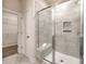 Modern shower features tile surround, glass door, and a convenient built-in bench at 13210 Kenworth Rd, Charlotte, NC 28278