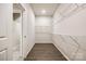 The walk-in closet shows wood flooring and shelving for storage at 13210 Kenworth Rd, Charlotte, NC 28278