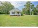 Charming single-story home with white siding, a covered porch, and well-maintained landscaping at 1343 Flint Hill St, Rock Hill, SC 29730