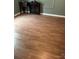 Inviting living room showcasing laminate wood flooring, complemented by green walls and classic trim details at 1343 Flint Hill St, Rock Hill, SC 29730