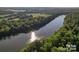 Beautiful aerial view of Catawba River winding through lush green forest and fields at 1507 Riverwalk Pkwy, Rock Hill, SC 29730