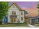 Beautiful two-story home with a welcoming porch and a colorful sunset backdrop at 1507 Riverwalk Pkwy, Rock Hill, SC 29730