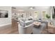 Open-concept living room with stylish furniture and hardwood floors, connected to the kitchen at 1507 Riverwalk Pkwy, Rock Hill, SC 29730