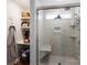 Beautiful bathroom with a glass enclosed shower, built-in shelving and a walk-in closet at 1509 Kirkbridge Ct, Matthews, NC 28105