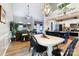 Open-concept dining room with a kitchen and fireplace view at 1509 Kirkbridge Ct, Matthews, NC 28105
