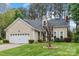 Charming single-story home with a well-manicured lawn and attached two-car garage at 1509 Kirkbridge Ct, Matthews, NC 28105