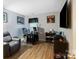 A comfortable office space with wood floors, a ceiling fan, a desk, and a leather chair at 1509 Kirkbridge Ct, Matthews, NC 28105